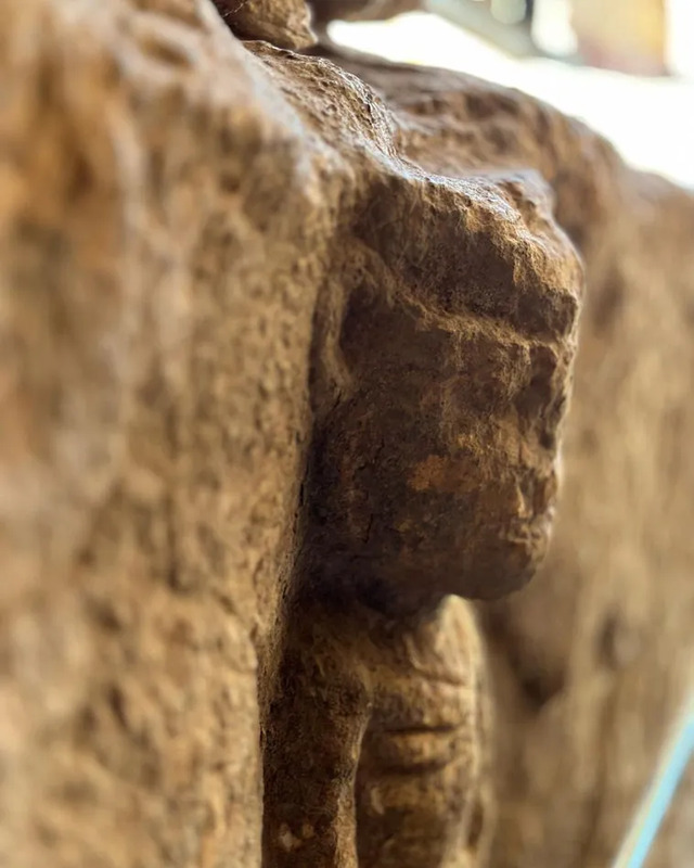 A close-up of a carved human figure discovered at Göbeklitepe, showcasing early artistic renditions of human anatomy.