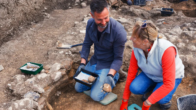 Archaeologists and volunteers examining artifacts uncovered in the remains of the Roman villa complex in Wiltshire's Chalke Valley. Credit: Teffont Archaeology.
