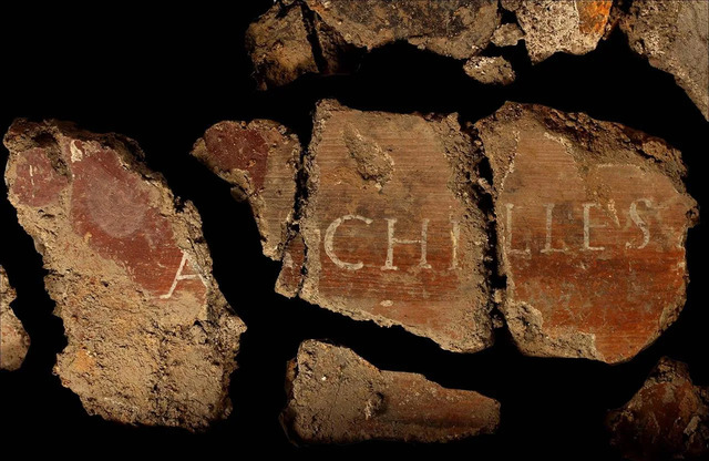 Fragments of painted plaster adorned with inscriptions of the mythological figure Achilles offer a glimpse into the artistry of ancient Rome. (Credit: Jean-Jacques Bigot, Inrap)