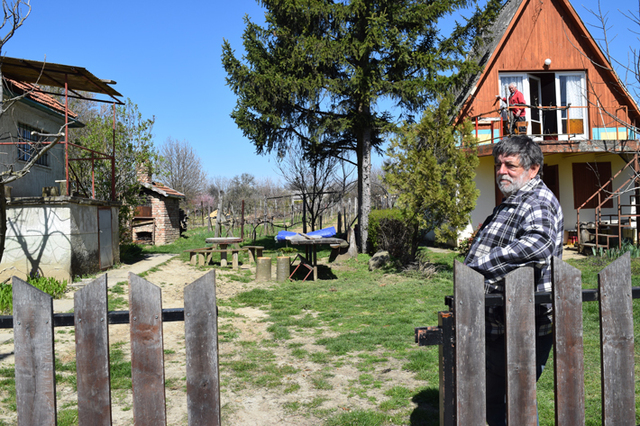Gyula Kereszturi stands in his yard, the site where remains of buildings from the sultan’s memorial complex were unearthed. (Credit: Courtesy Sara Toth Stub)
