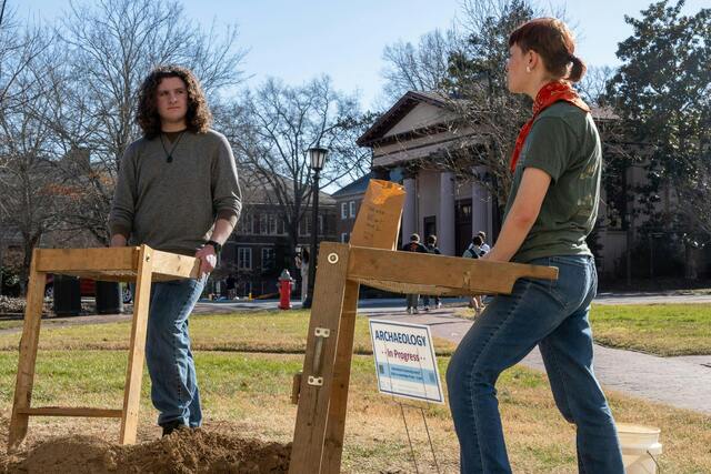 Archaeology students Caden Kavanaugh and Logan Smiley sift through material excavated from the New East site on February 4, 2025, continuing their research into the campus’s early history. (Photo by McKenzie Bulris / The Daily Tar Heel)