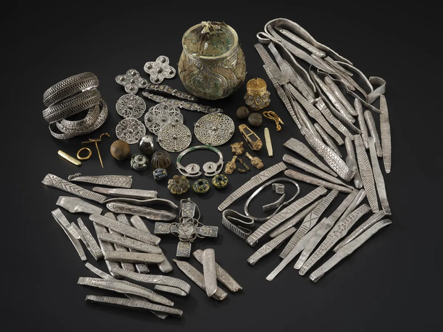 A selection of artifacts from the Galloway Hoard, including silver and gold items, religious objects, and other valuable relics, showcasing the wealth and craftsmanship of the period. (Image credit: National Museums Scotland)