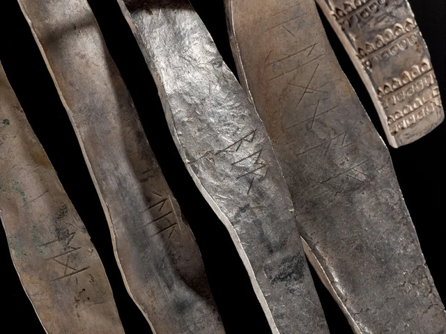 Each silver arm ring from the Galloway Hoard is adorned with runic inscriptions, which remained a mystery until now. (Image credit: National Museums Scotland)
