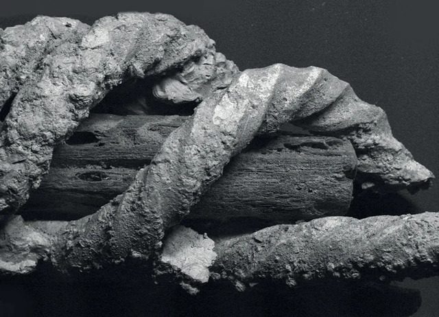 Under a scanning electron microscope, this coiled bronze torc reveals a core of charred wood, preserved through the ages.