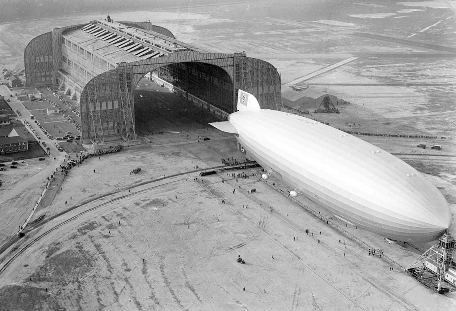 The German-built Hindenburg docks at Lakehurst, New Jersey, on May 9, 1936, following a record-breaking North Atlantic crossing—one of ten round trips planned between Germany and the United States.