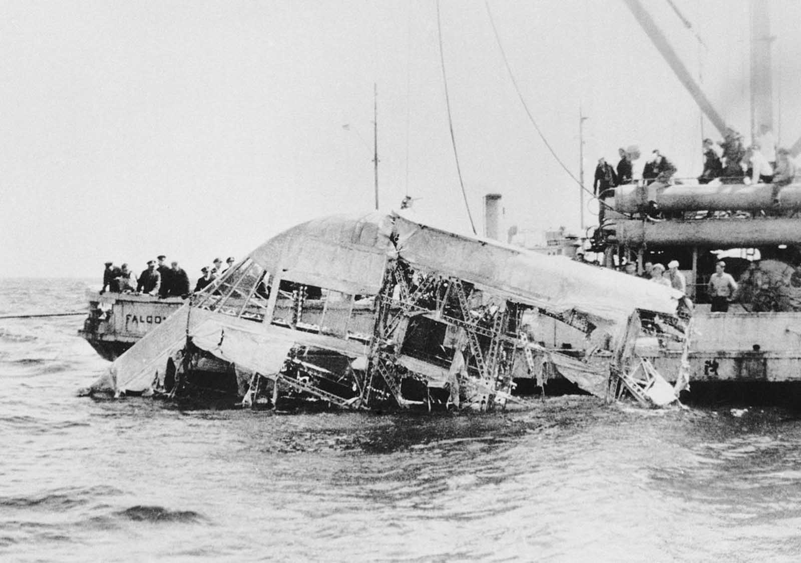The wreckage of the USS Akron is retrieved from the Atlantic Ocean off the New Jersey coast on April 23, 1933. A violent storm had sent the massive airship crashing into the sea, resulting in the loss of 73 lives—more than twice as many as the Hindenburg disaster.