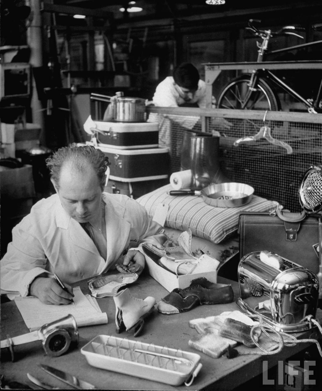 A Macy’s staff member inspects shoe quality in the department’s testing area in 1948