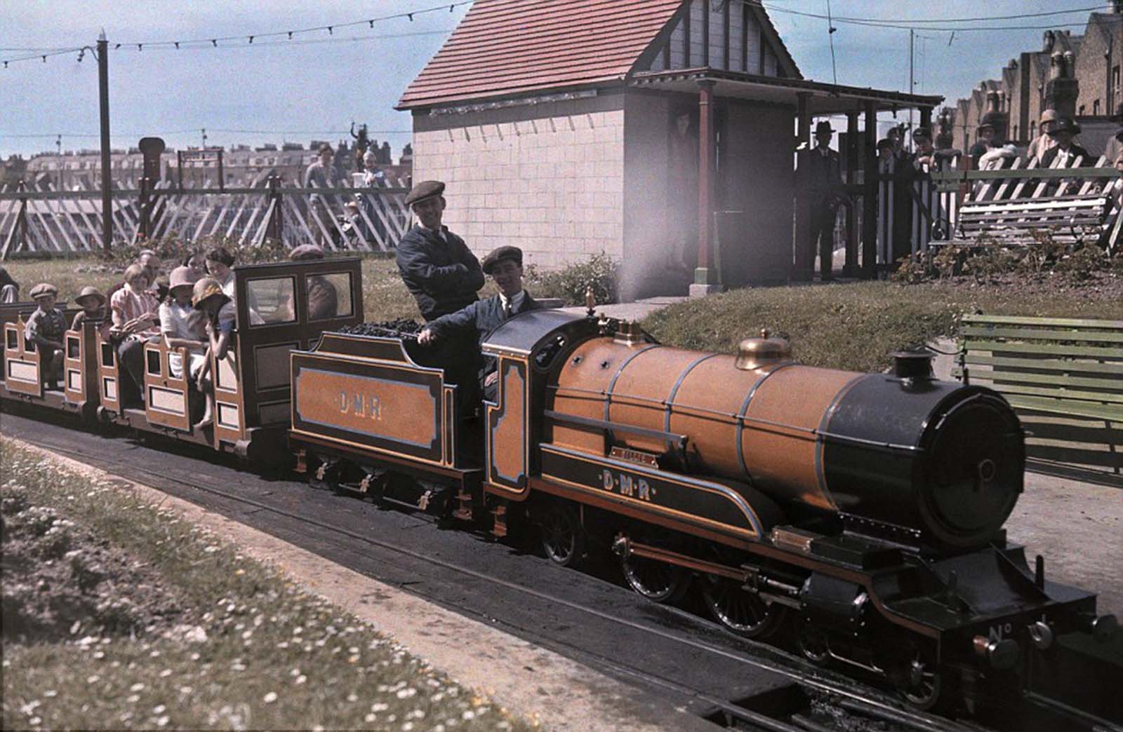 A Ride on ‘Billy’ – Passengers take a trip on ‘Billy,’ a popular seaside locomotive in Margate, Kent, in 1931.