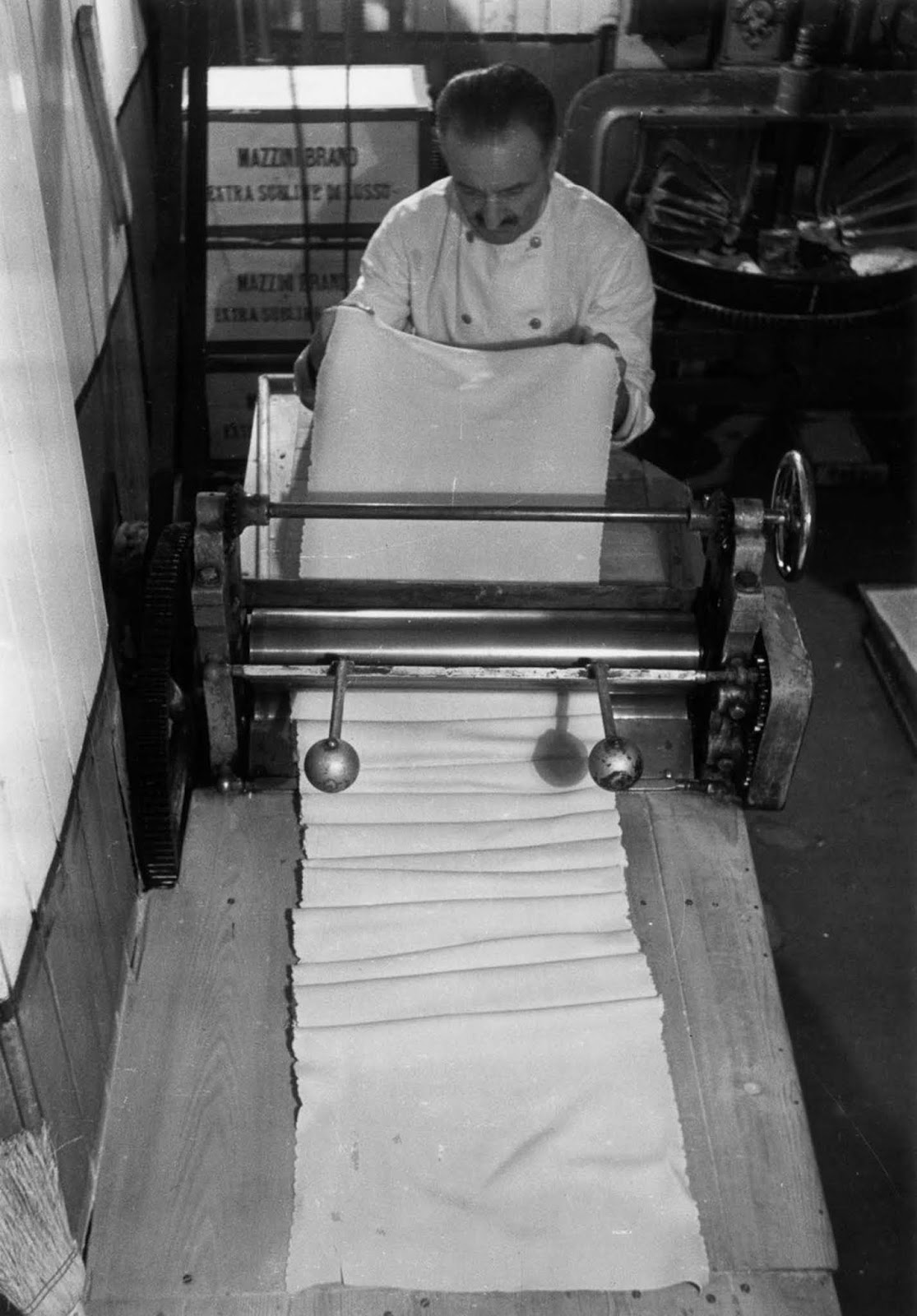 A chef skillfully crafts tagliatelle at King Bomba’s, one of Soho’s most famous Italian shops. London, 1939.
