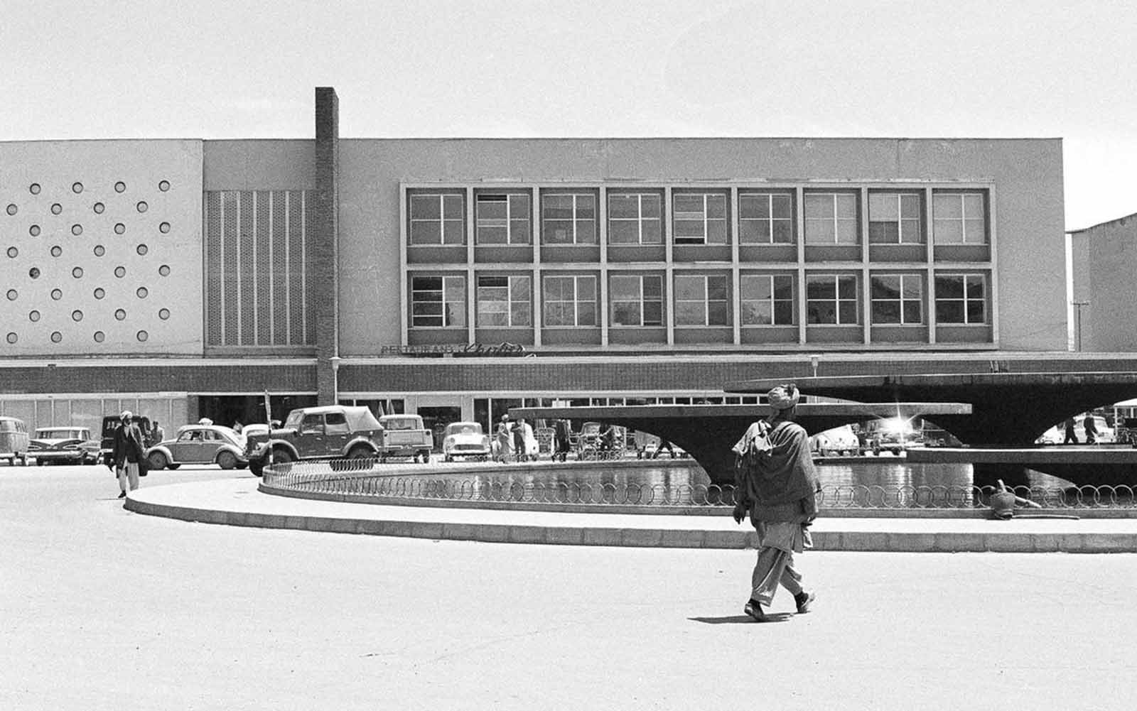 A modern landmark in Kabul—the newly built Finance Ministry in 1966, featuring a Western-style cafeteria and an illuminated water fountain.
