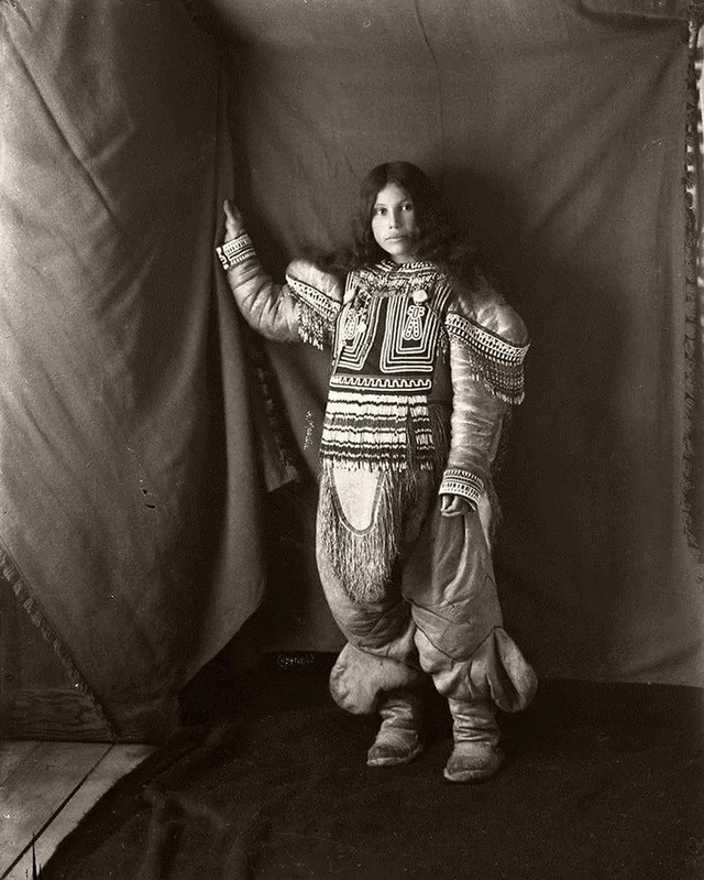 A portrait of Kootucktuck, an Inuit woman from Fullerton Harbour, Nunavut, wearing her intricate beaded attigi, taken in 1905 by Geraldine Moodie.