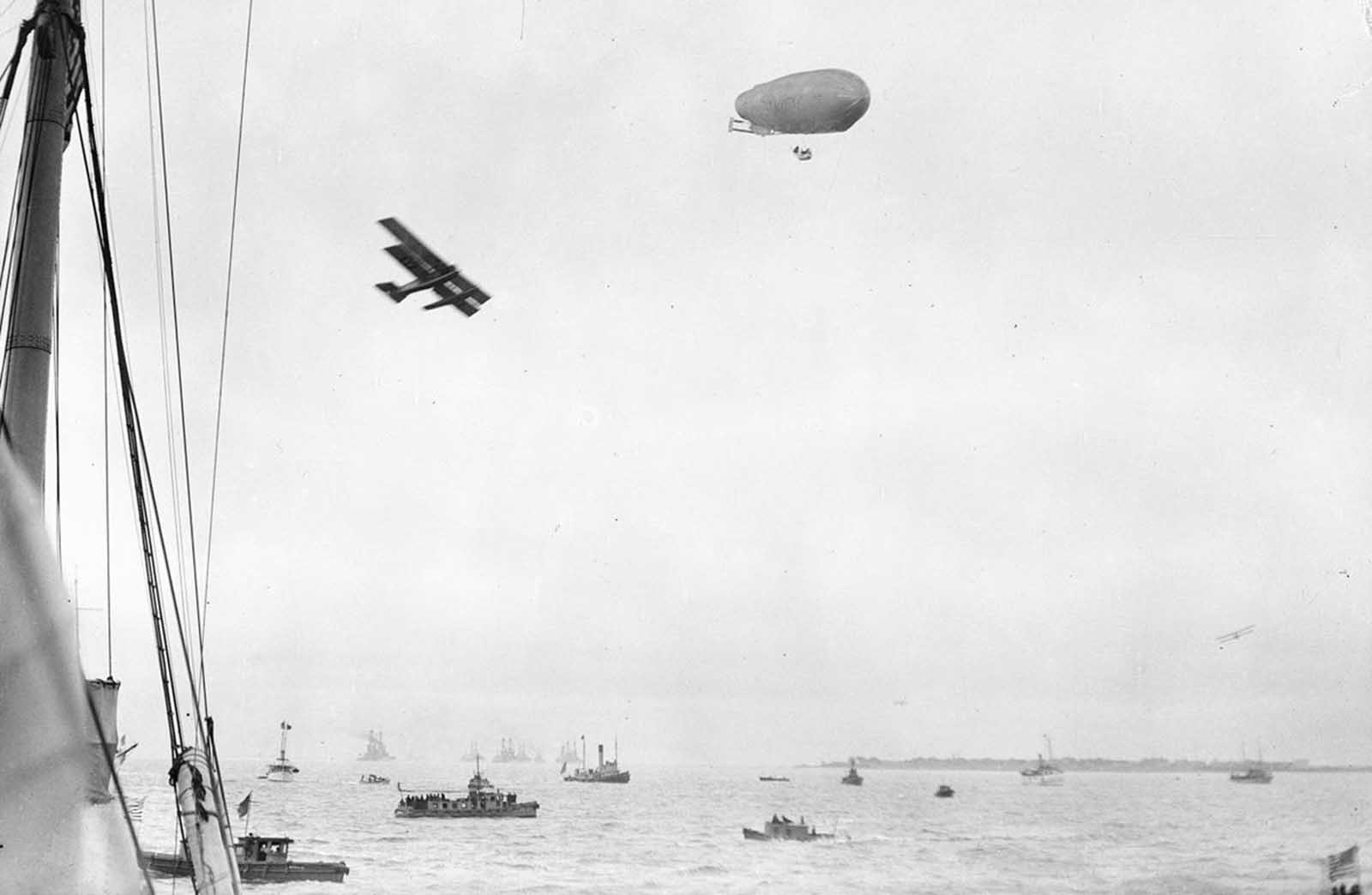 A rare scene featuring boats, an airplane, and an airship, circa 1922, possibly depicting the U.S. Navy’s SCDA O-1
