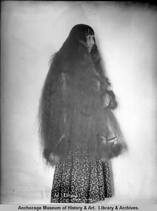 An Inuit woman with long flowing hair, photographed in Nome, Alaska during the 1890s.