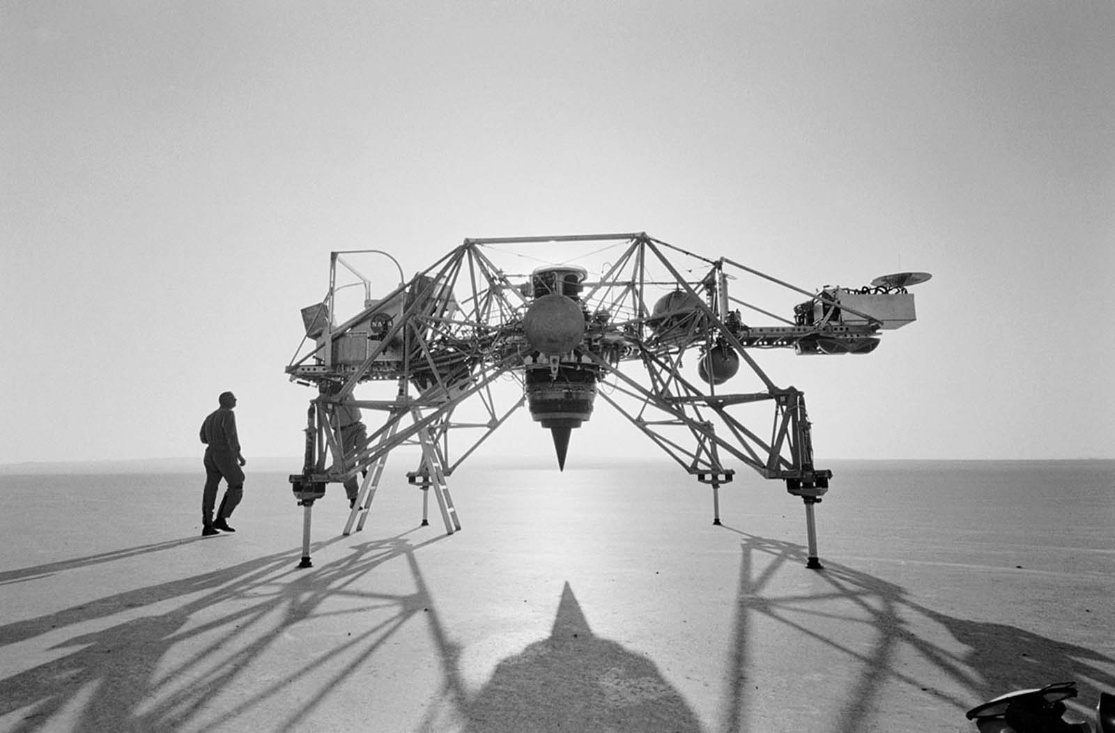 Astronaut Neil Armstrong (left) stands beside the Bell Aerosystems Lunar Landing Research Vehicle (LLRV) at Edwards Air Force Base, California, during Apollo 11 preparations.