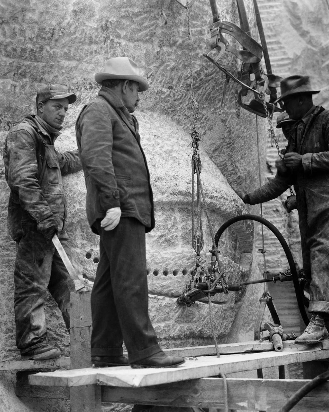Borglum inspects the eyes of one of the presidents, 1937.