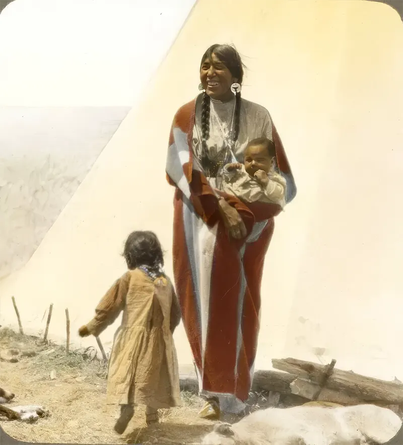 “Coming Running,” a Blackfeet woman watches over children in Montana. Early 1900s.