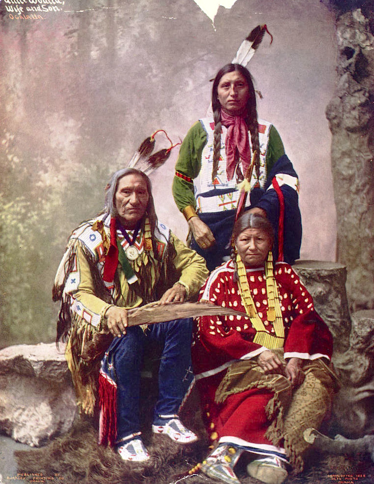 Eagle Arrow, a Siksika warrior, stands proud in Montana. Early 1900s. Captured in a glass lantern slide by Walter McClintock.