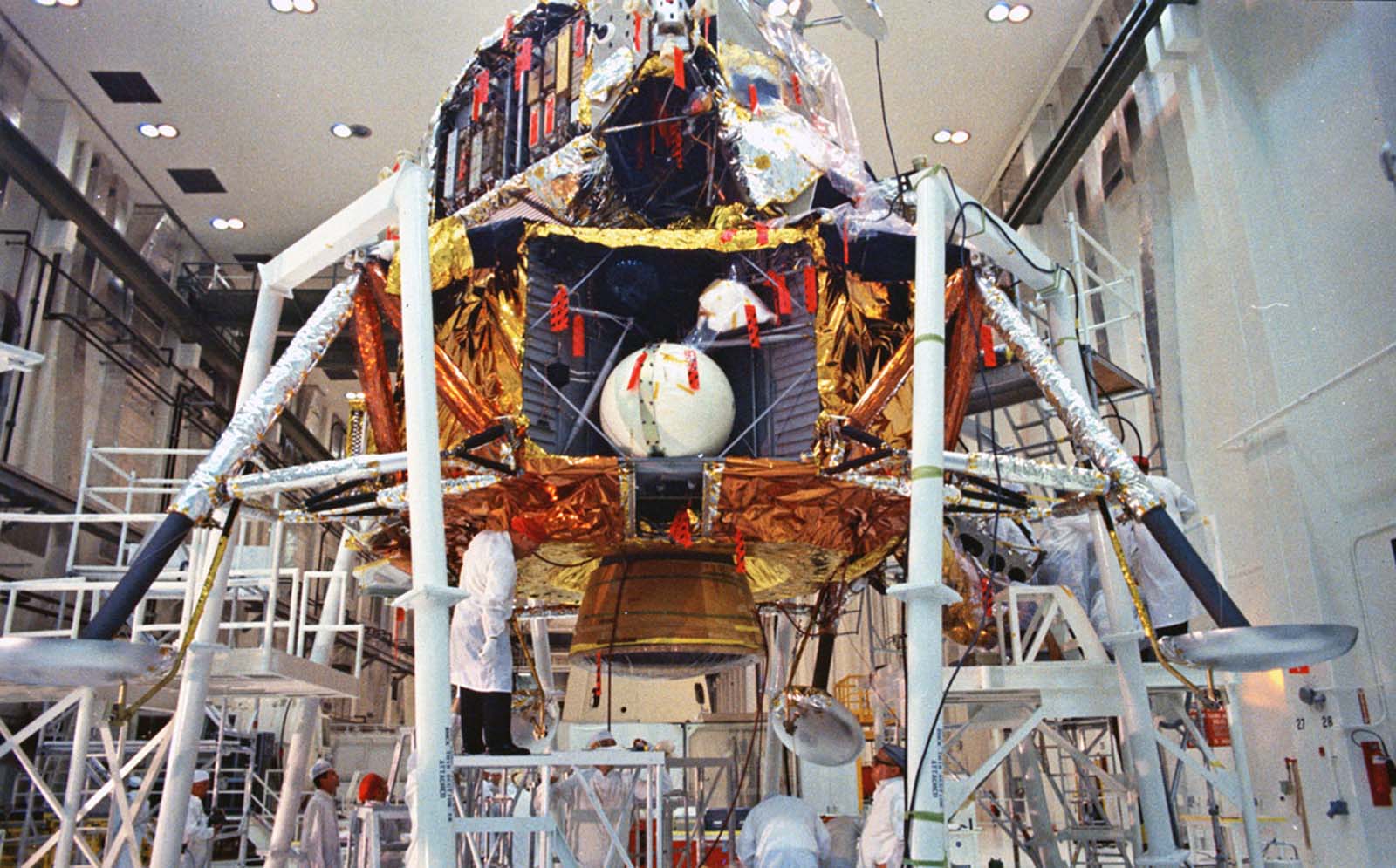 Final checks on the Apollo 11 lunar module take place inside the Manned Spacecraft Operations Building at Kennedy Space Center, April 11, 1969.