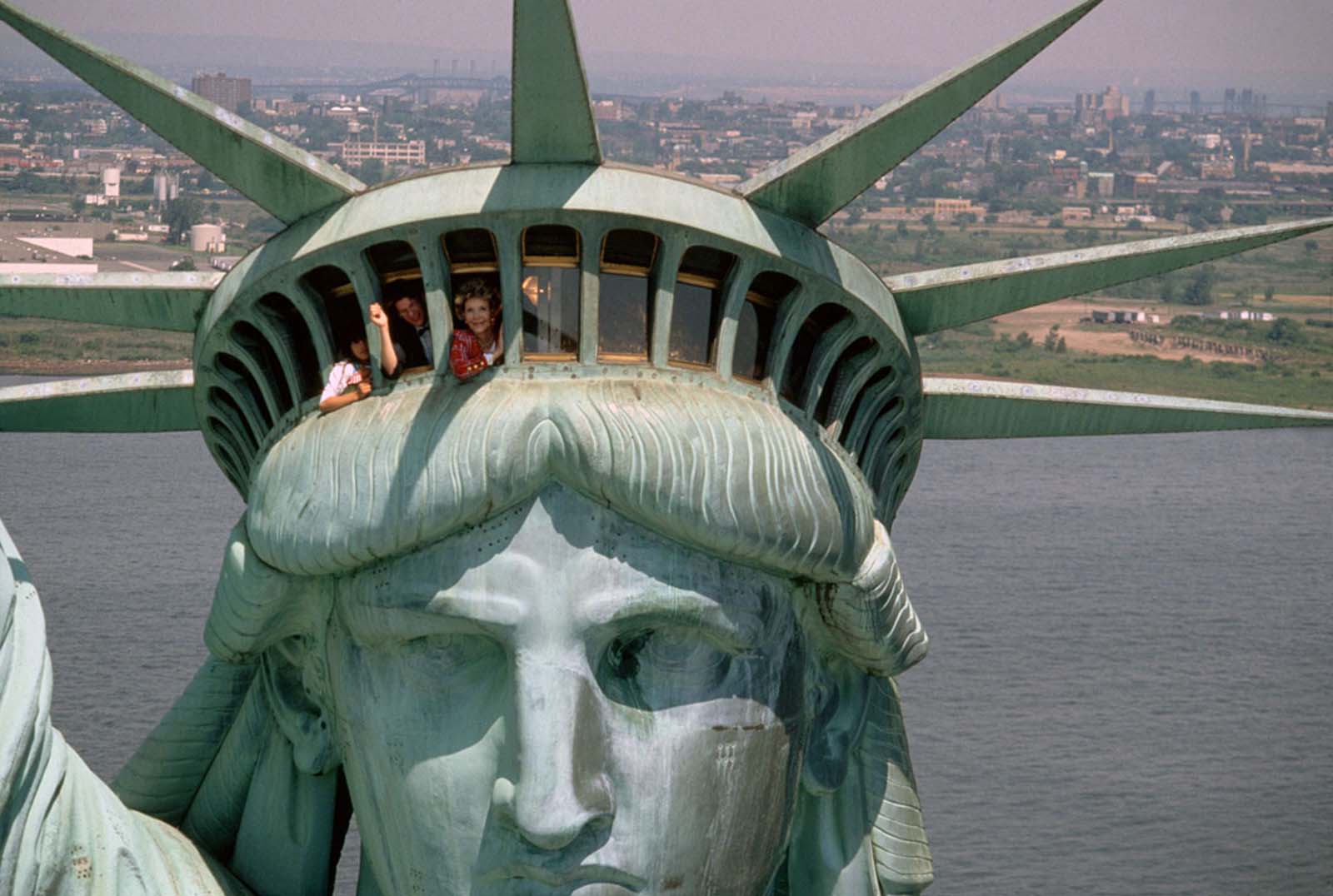First Lady Nancy Reagan waves from a helicopter as it hovers near the Statue of Liberty, the day after its centennial celebration in July 1986.