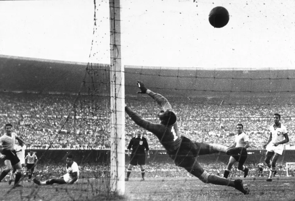 Ghiggia’s winning goal stuns Brazil as he slots the ball past goalkeeper Barbosa to secure Uruguay’s victory. Credit: Getty - Contributor