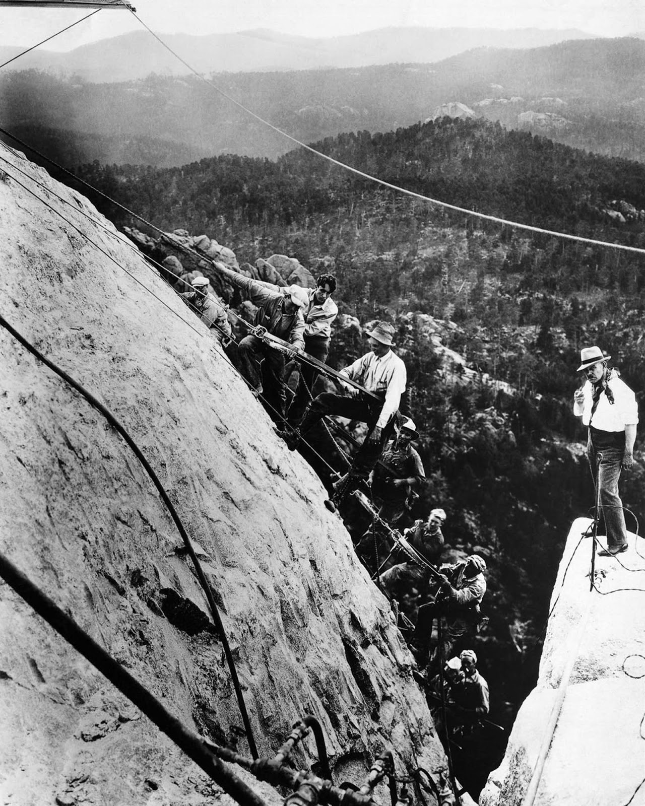 Gutzon Borglum (right) directs his sculpting team on George Washington’s forehead, 1929.
