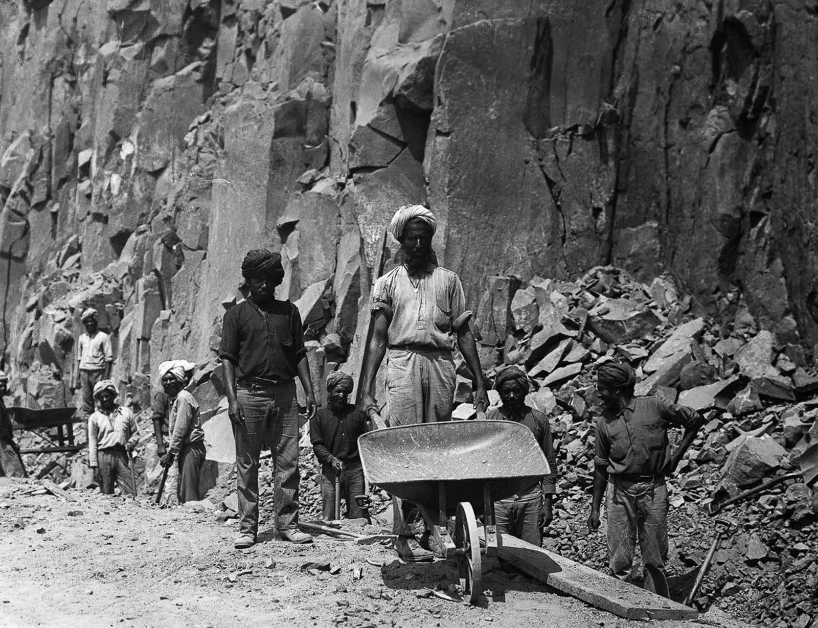 Manual excavation in progress—workers clear earth by hand in 1900.
