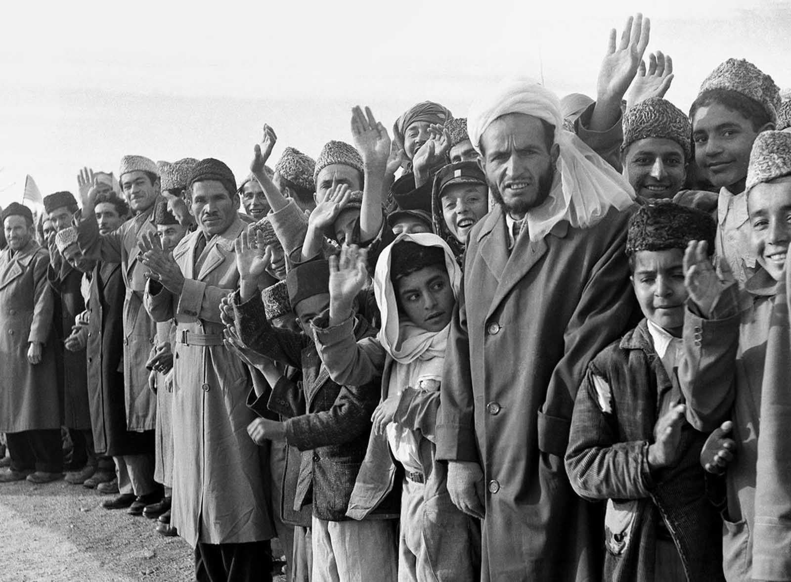 Residents of Kabul gather along the streets to witness U.S. President Dwight Eisenhower’s convoy, December 9, 1959.