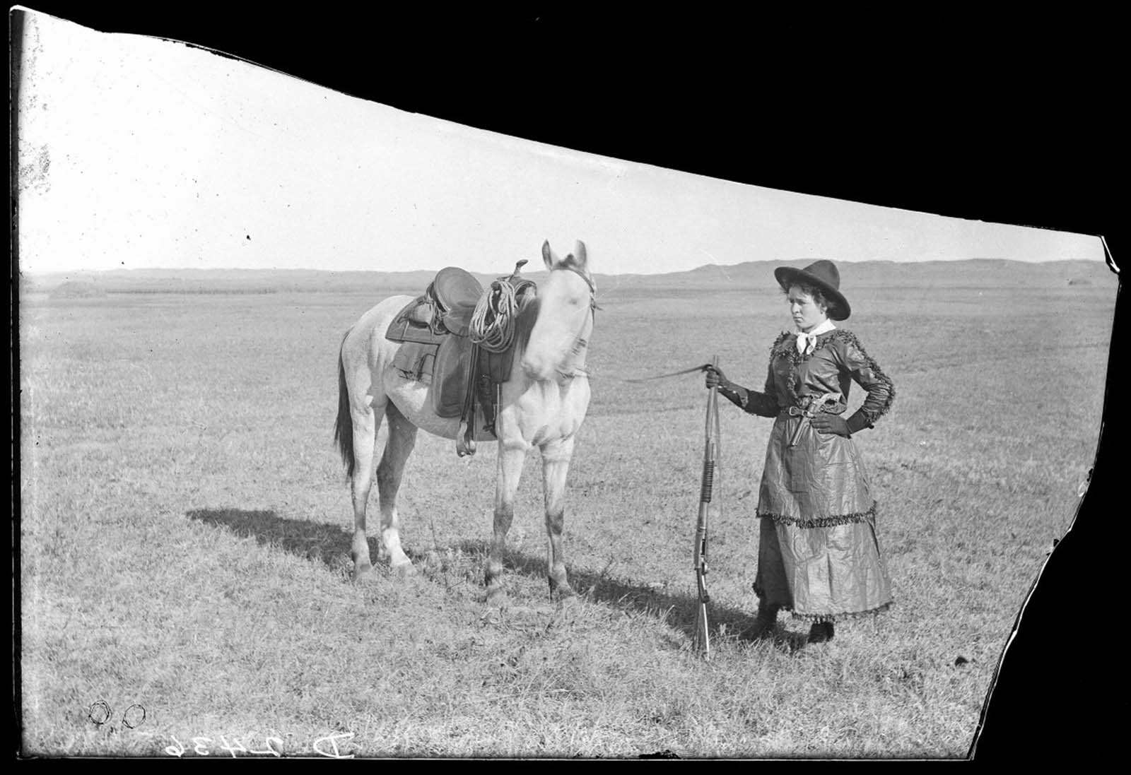 Riding the open plains – Sadie Austin, a fearless cowgirl, poses with her horse in Cherry County, Nebraska, 1900.