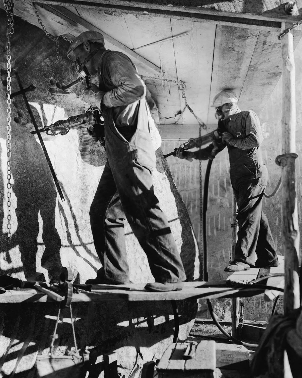 Stone carvers use air hammers to shape Theodore Roosevelt’s eyes, 1940.