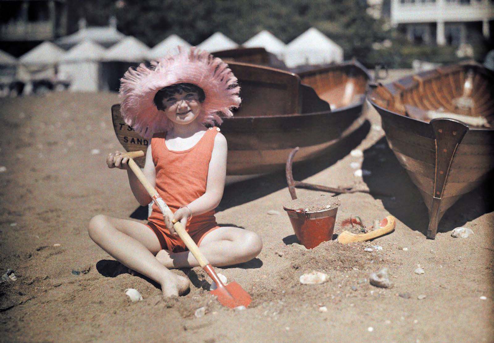 Summer Fun on the Isle of Wight – A young girl enjoys a carefree day playing in the sand at Sandown Beach.