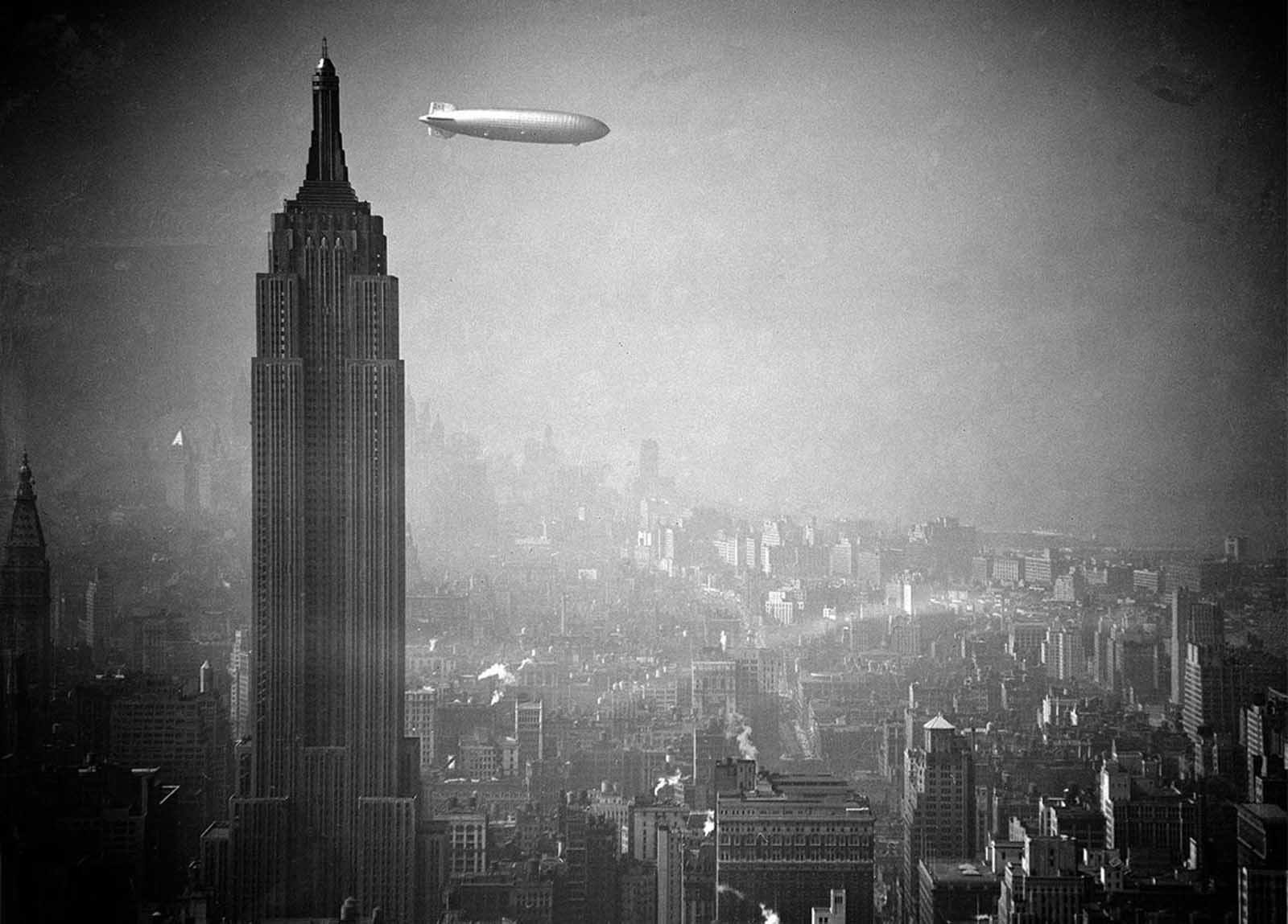 The German airship Hindenburg drifts past the Empire State Building en route to Lakehurst, New Jersey, from Germany on August 8, 1936.
