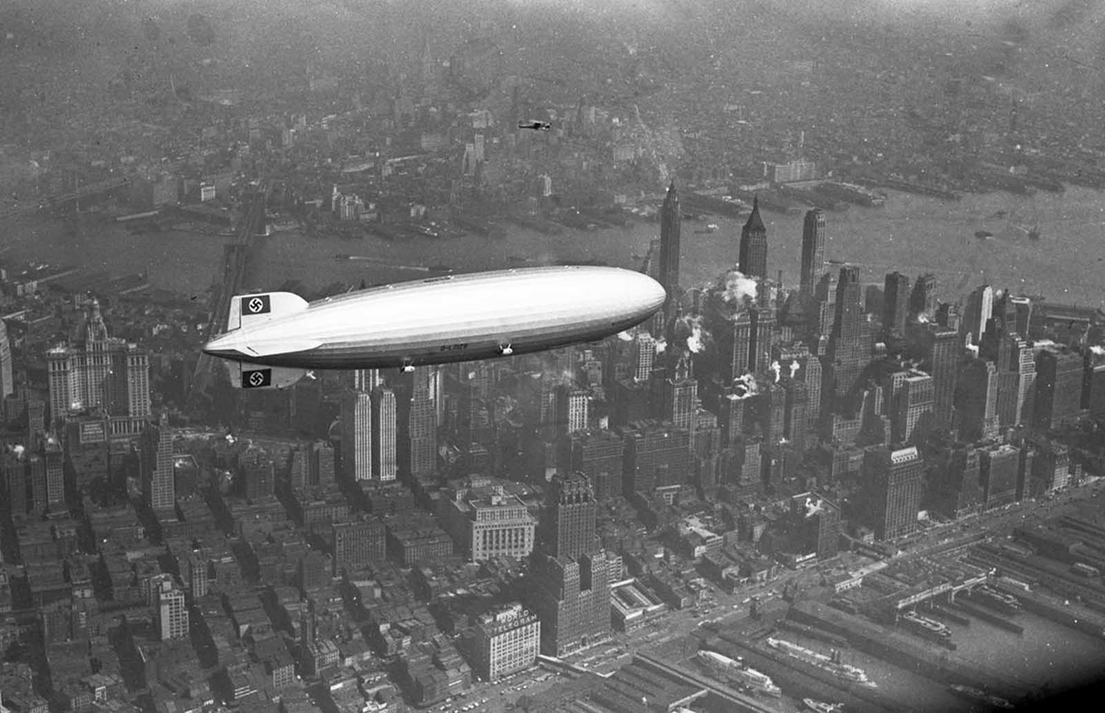 The Hindenburg floats over Manhattan on May 6, 1937—just hours before its catastrophic explosion at Lakehurst, New Jersey.