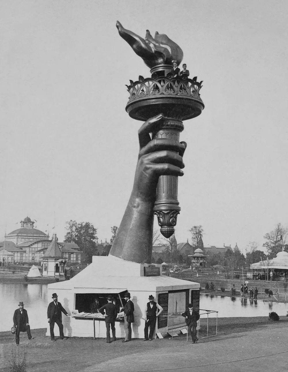 The Statue of Liberty’s right arm and torch on display at the 1876 Centennial Exposition in Philadelphia, capturing public imagination.