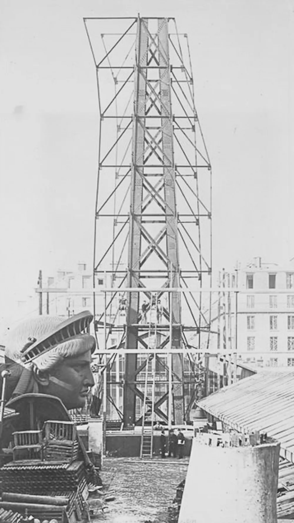The internal framework of the statue takes shape as engineers assemble its iron skeleton in preparation for the copper exterior.