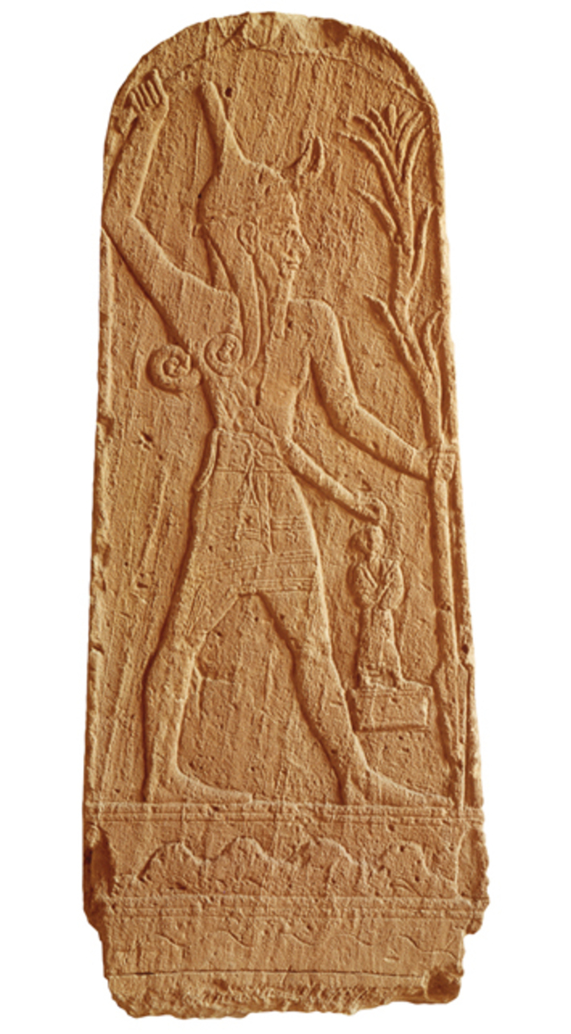 A limestone stela found atop Ugarit’s acropolis is thought to depict Baal, the city’s patron deity, wielding a thunderbolt or club while driving a spear into the earth, with a small figure possibly representing the king. (Erich Lessing/Art Resource)