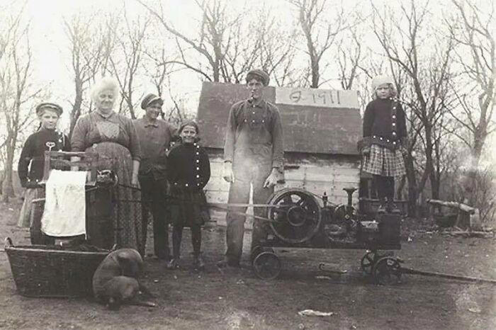 A Southern Ohio family proudly standing in front of their new washing machine, 1911.