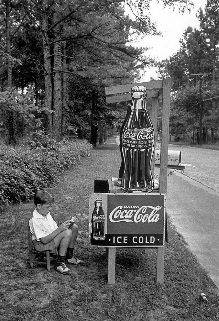 A boy selling Coca-Cola from a roadside stand, 1936.