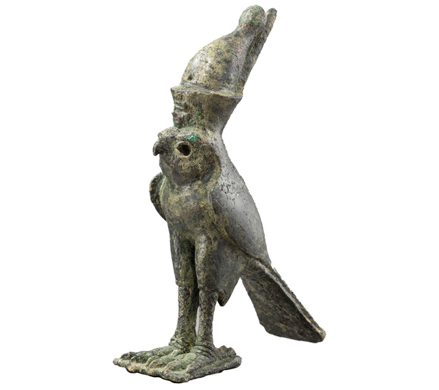 A bronze falcon god figurine, adorned with an Egyptian crown, was unearthed in Ugarit. (RMN-Grand Palais/Art Resource)