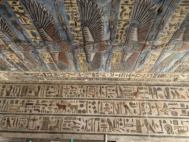 A close-up view of the temple ceiling in Esna showcases the artistic brilliance of the Hellenistic period, with vibrant representations of celestial gods and themes.