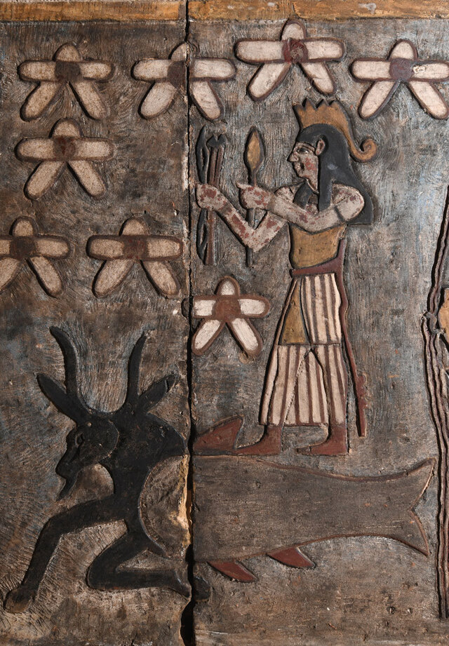A depiction of a war god wielding a weapon, representing the planet Mars, stands triumphantly atop the fish-tailed goat Capricorn.
