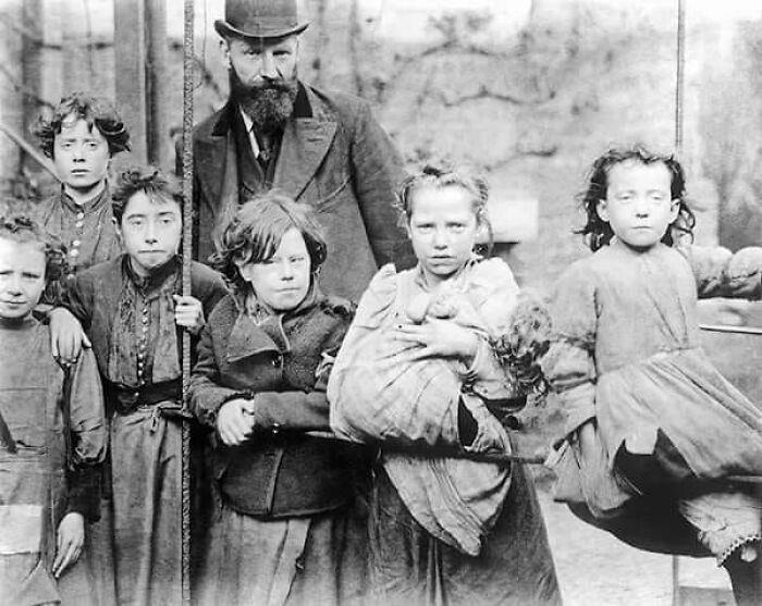 A family living in London's slums during the early 1900s.