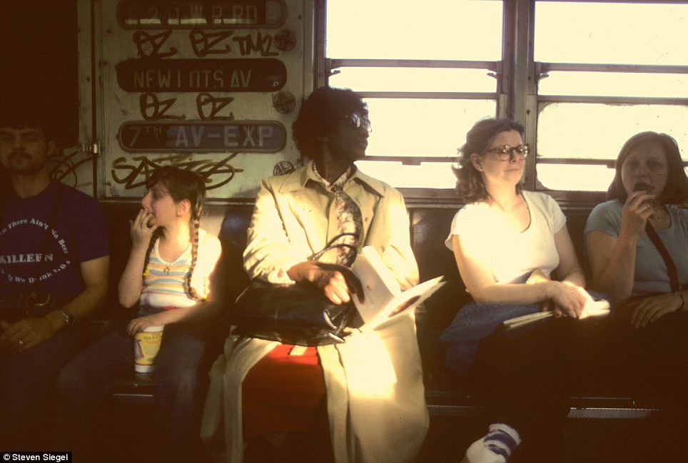 A fleeting moment in time as commuters move through the New York subway in the 1980s, bathed in rare sunlight.