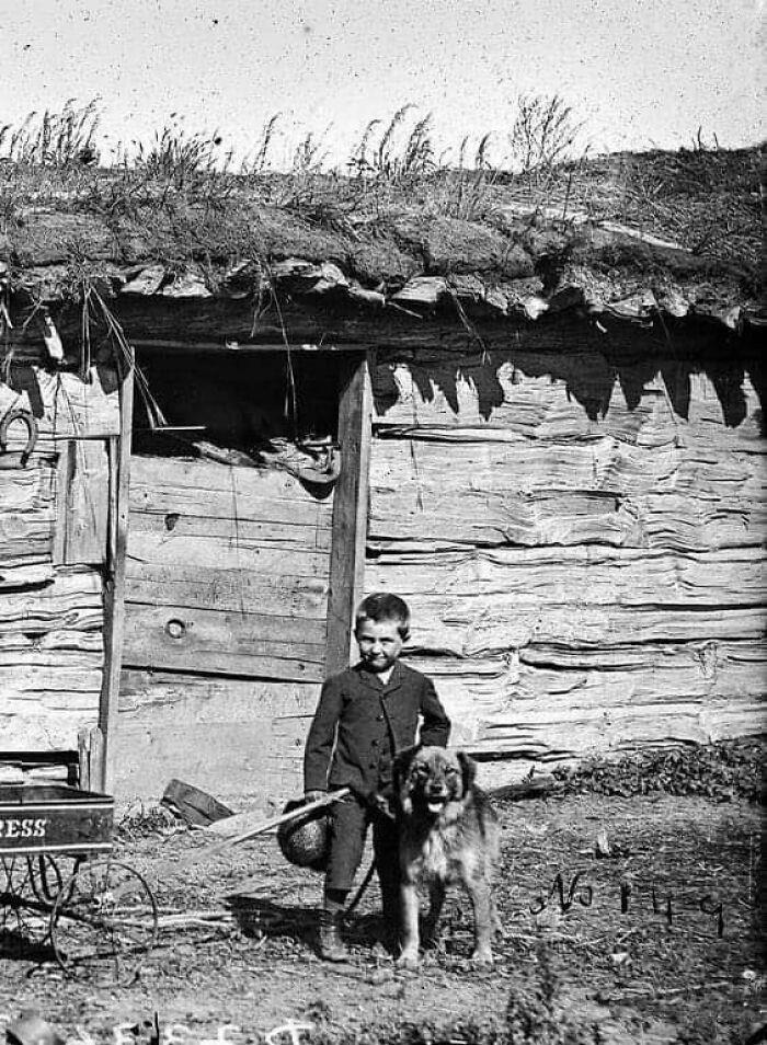 A young boy and his loyal dog, captured in 1889.