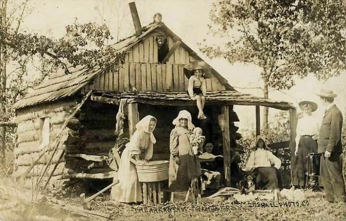 An Ozark Mountain family outside their cabin in Arkansas.
