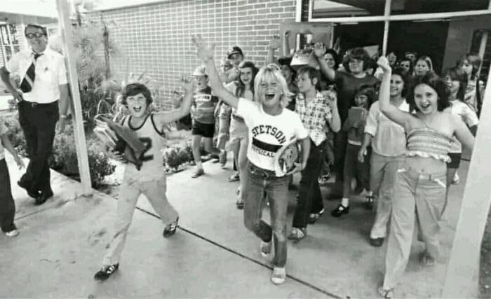 Kids excitedly cheering on the last day of school, 1977.