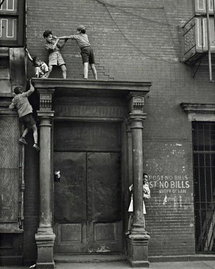 Kids playing joyfully in New York during the 1940s.