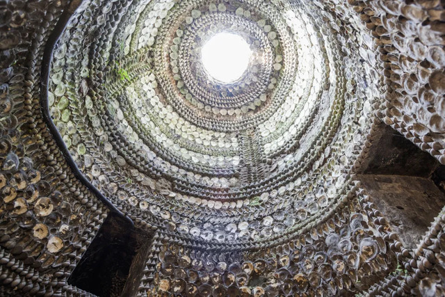 Looking up through the layers of shells within the Grotto, revealing natural light.