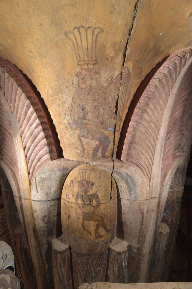 One interior capital showcases the dwarf deity Bes, depicted playing both a harp and a drum, hinting at the musical atmosphere of the festivities.