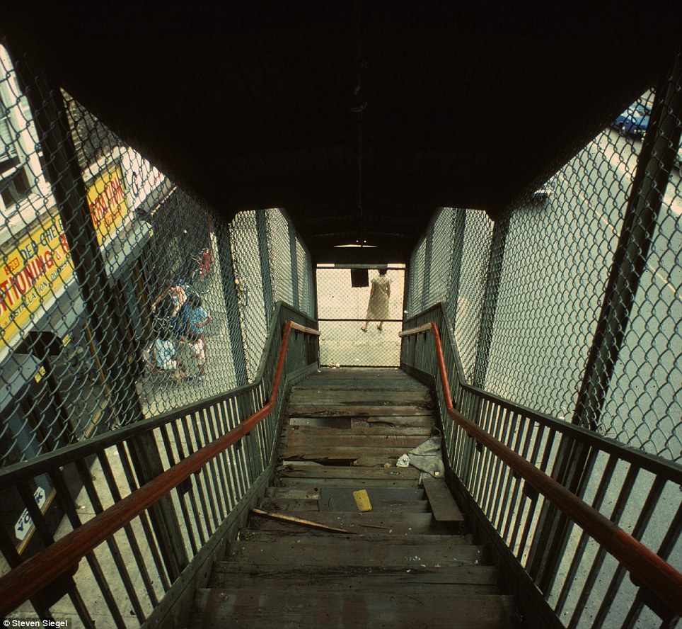 Siegel captures a set of worn and repaired stairs in a New York subway station, an unspoken testament to the city's age.