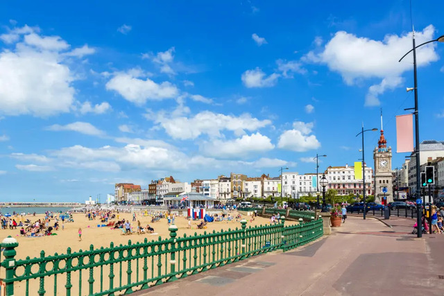 The sunny, bustling beachfront of Margate, a popular coastal destination.